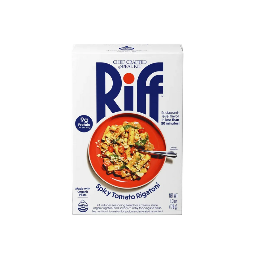 A boxed cooking kit labeled Riff Chef-Crafted Meal Kit, featuring a white package with large blue Riff branding and a central photo of a red plate of tomato ragoutoni. The package also shows 'Spicy Tomato Ragoutoni' and a blue circular badge reading 9g fat per serving.